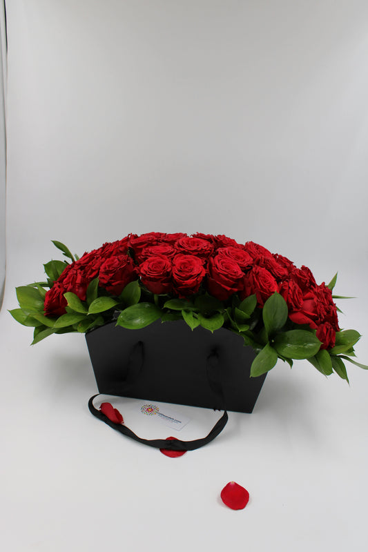 red roses in balck bag