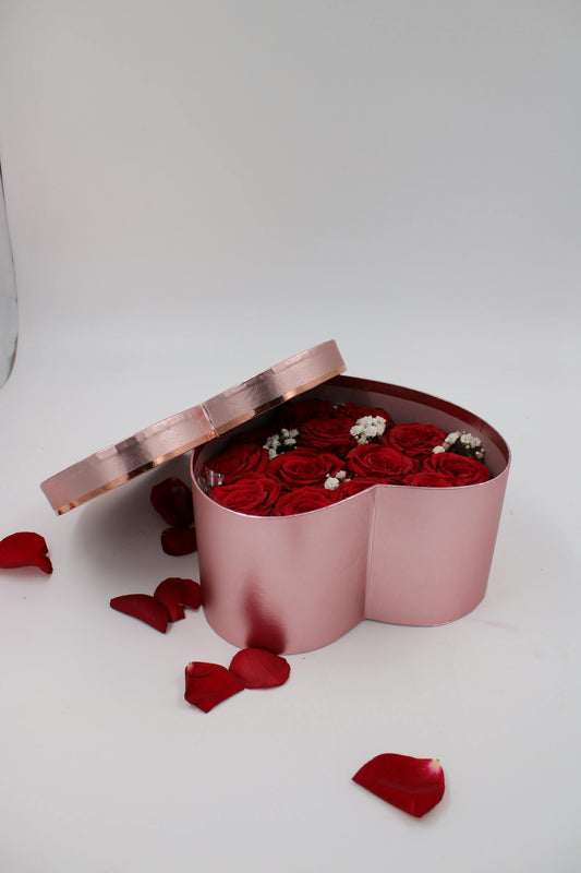 red roses in pink box